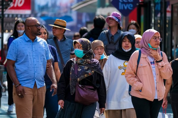 KUALA LUMPUR, MALAYSIA - FEBRUARY 22, 2020 : People wearing face mask to prevent infection of virus at Bukit Bintang. Bukit Bintang is a famous tourist attraction place.